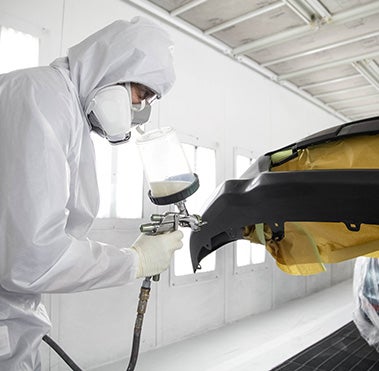Collision Center Technician Painting a Vehicle | Interstate Toyota in Airmont NY