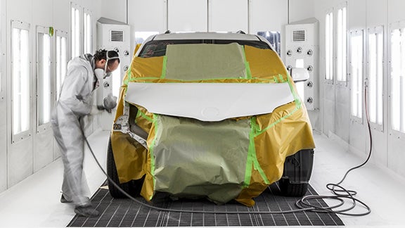 Collision Center Technician Painting a Vehicle | Interstate Toyota in Airmont NY